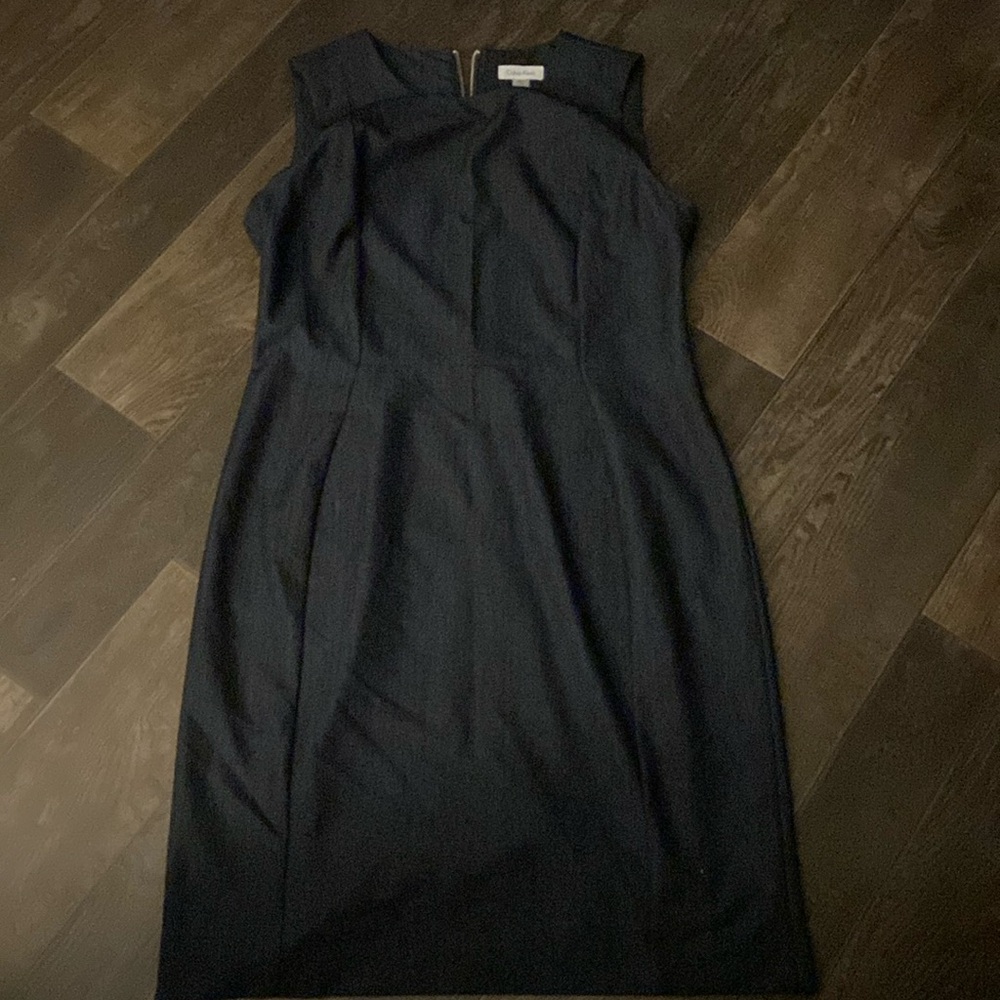 Dark blue , form fitting dress.